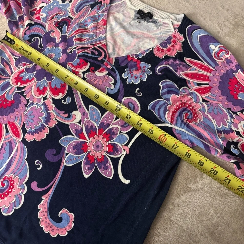 Talbots floral patterned, 3/4 sleeve knit top with a v-neckline and side slits.